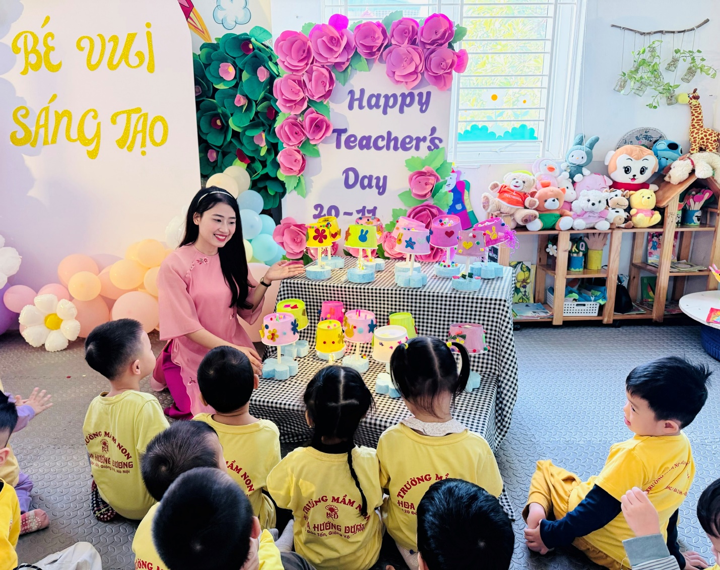 A group of children sitting in a room with a person standing in front of a sign

AI-generated content may be incorrect.