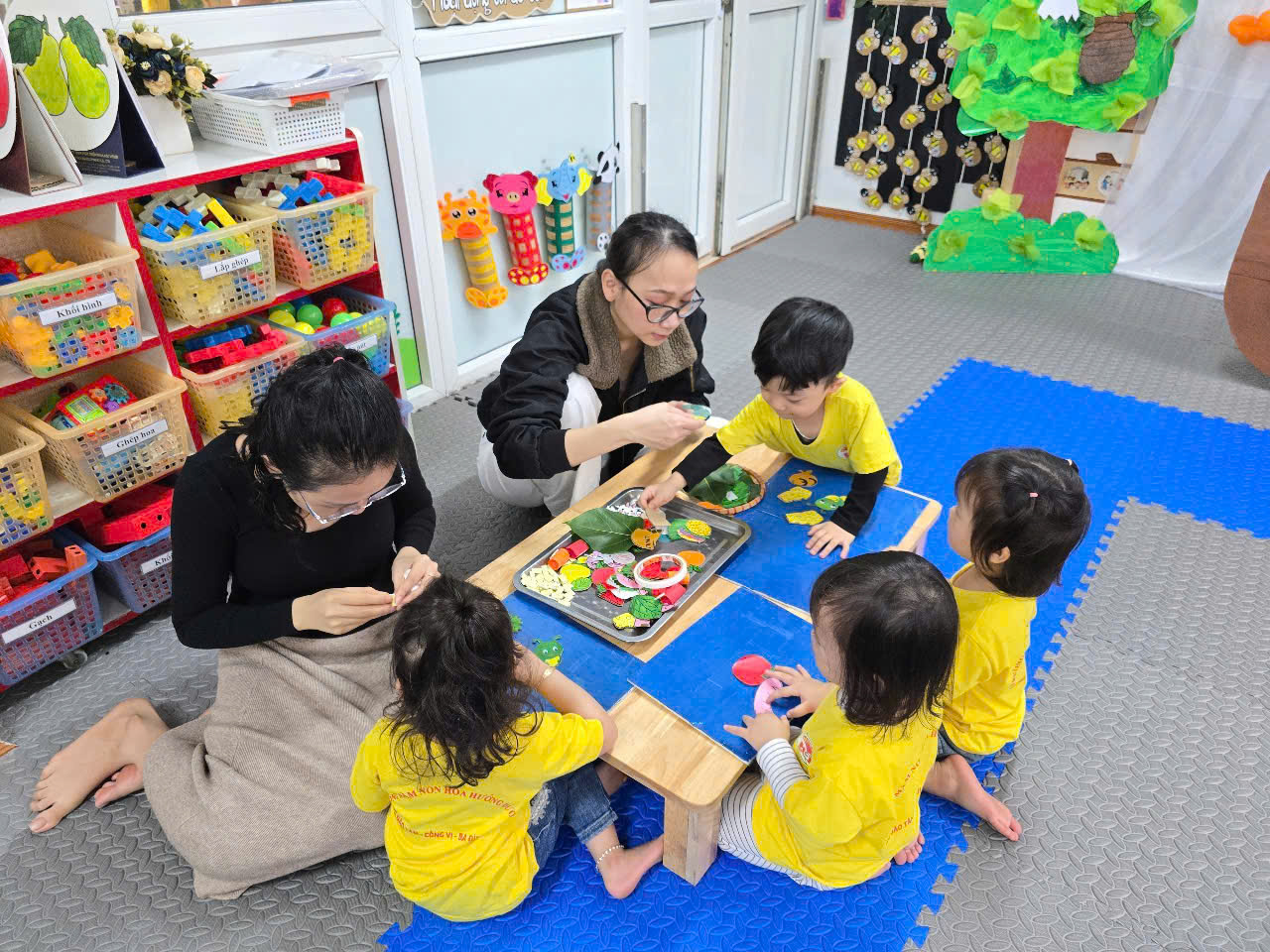 A group of children playing with a person
AI-generated content may be incorrect.